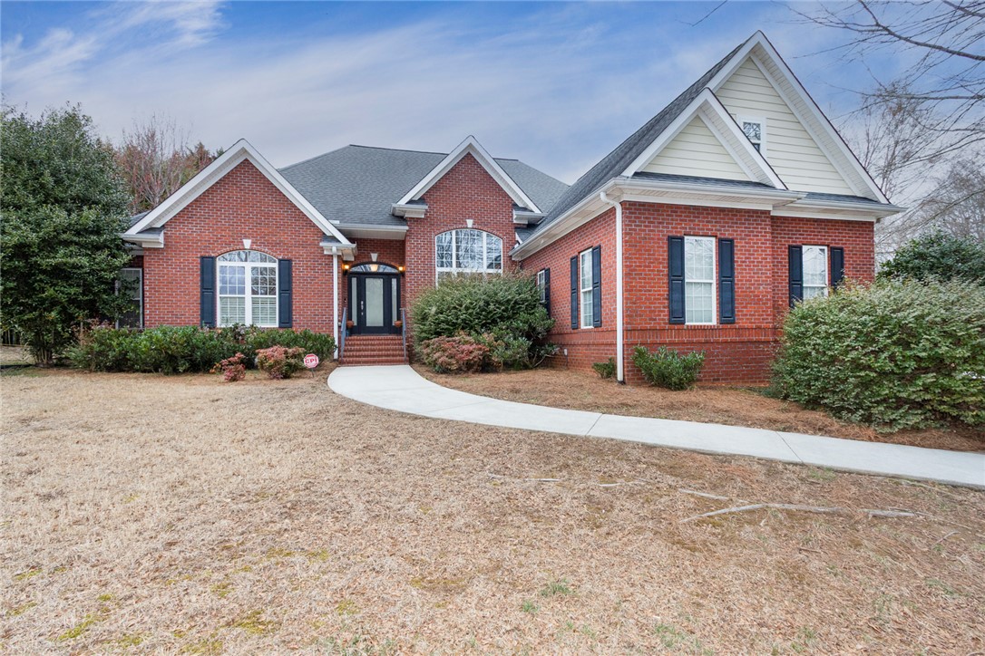 105 Sycamore Drive Clemson, SC 29631 - Photo 2 of 35 This brick residence offers a classic facade with clean lines and inviting curb appeal.