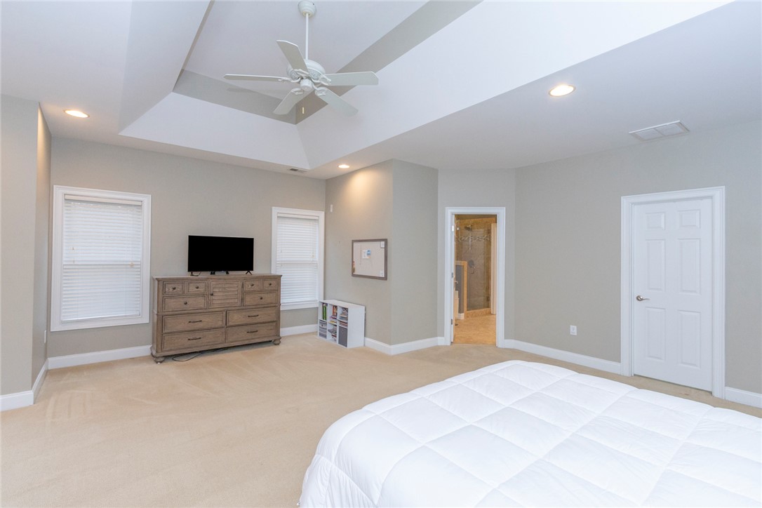 105 Sycamore Drive Clemson, SC 29631 - Photo 23 of 35 This spacious primary bedroom features a vaulted ceiling and an attached private bathroom.