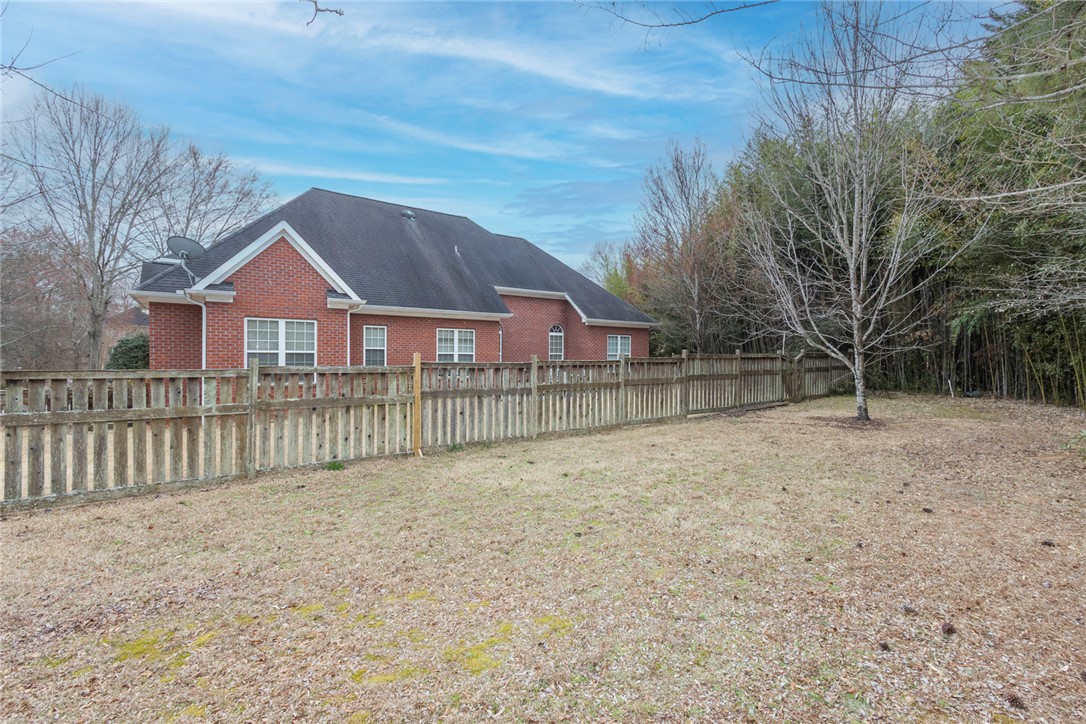 105 Sycamore Drive Clemson, SC 29631 - Photo 26 of 35 This residence features a fenced private yard, offering both security and ample outdoor space.