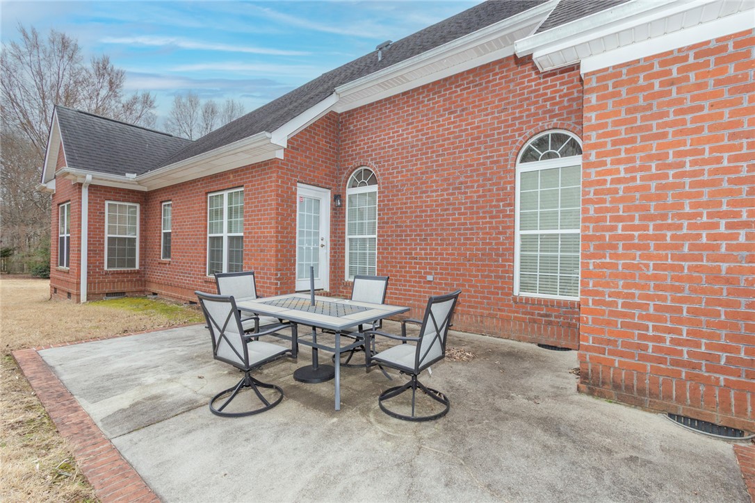 105 Sycamore Drive Clemson, SC 29631 - Photo 30 of 35 This brick residence features an inviting patio area, perfect for outdoor relaxation and entertaining.