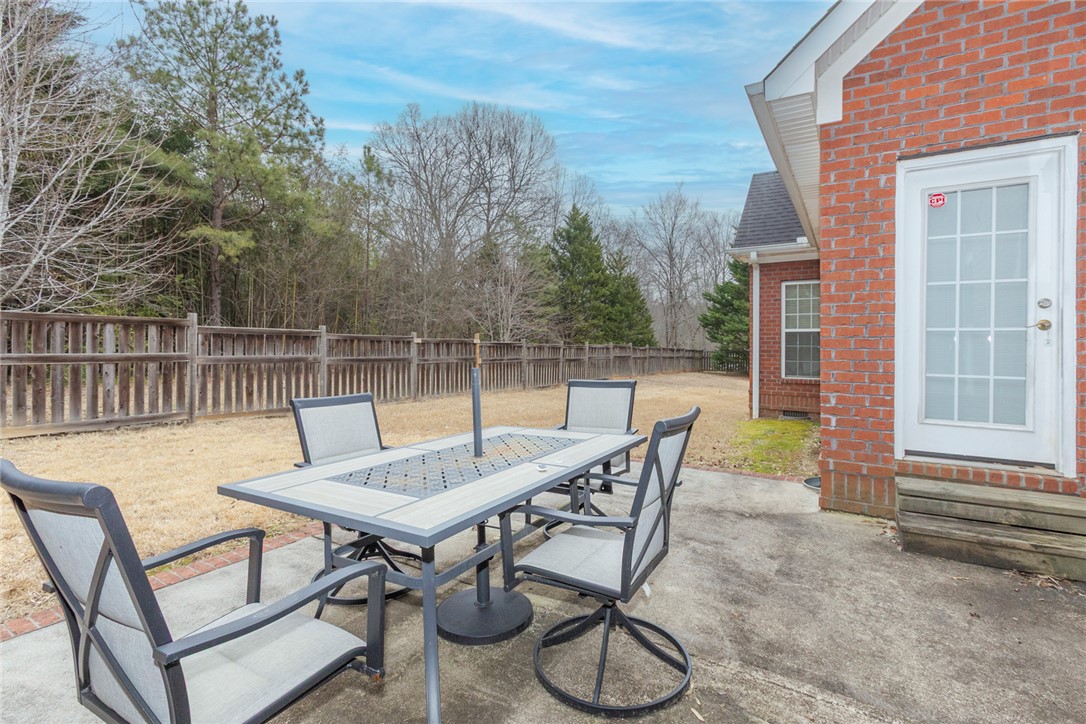 105 Sycamore Drive Clemson, SC 29631 - Photo 31 of 35 This concrete patio offers a private outdoor space for relaxation and gatherings.