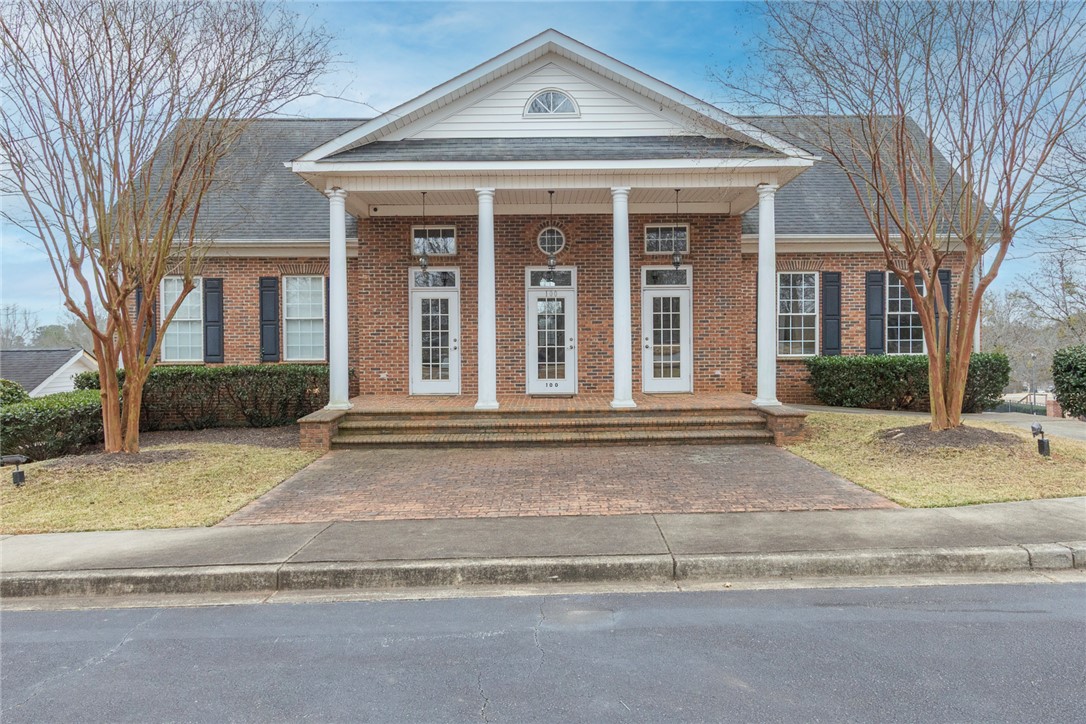 105 Sycamore Drive Clemson, SC 29631 - Photo 33 of 35 This classic brick structure features a welcoming covered porch, ideal for community gatherings.