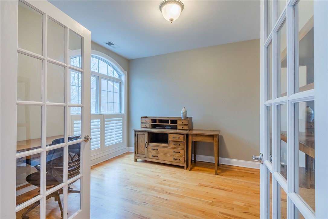 105 Sycamore Drive Clemson, SC 29631 - Photo 6 of 35 This bright office space features French doors, hardwood floors, and a large arched window with shutters.