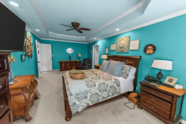 a bed room with furniture and a flat screen tv