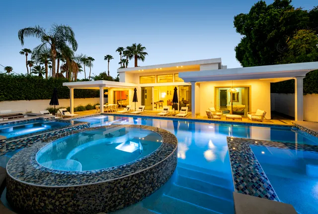 a view of a swimming pool with a patio