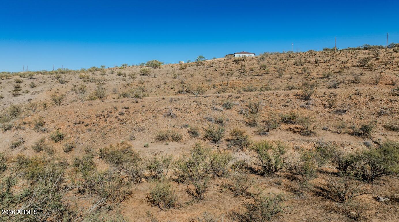 338 Anfibio Court, Unit 79 Rio Rico, AZ 85648 - Photo 13 of 13 a view of a yard with a building in the background