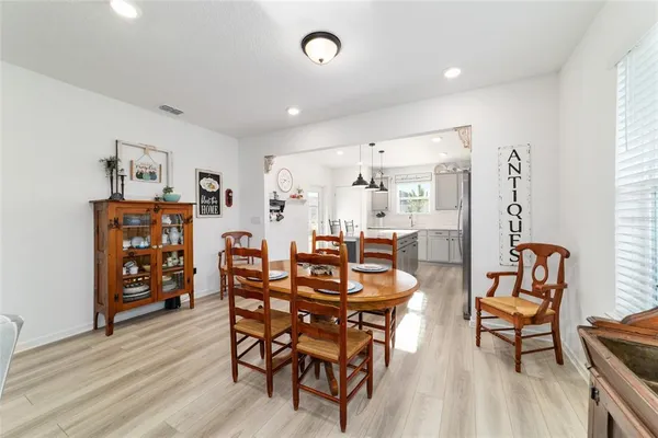 a kitchen with a refrigerator a sink dishwasher a stove and a refrigerator