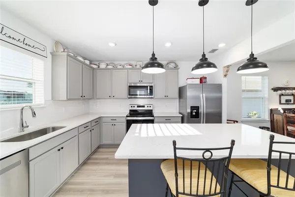 a bedroom with a bed closet and flat tv screen