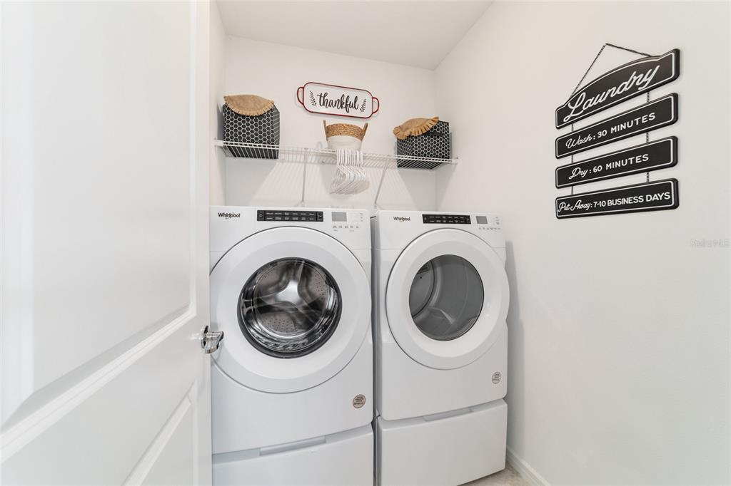 8392 Southwest 54th Street Ocala, FL 34481 - Photo 27 of 59 a utility room with dryer and washer