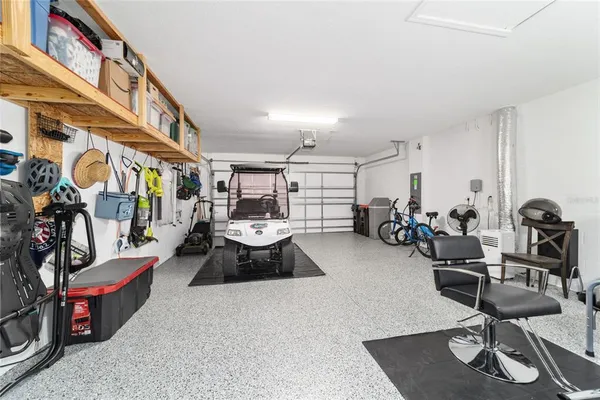 a dining room with furniture and a floor to ceiling window