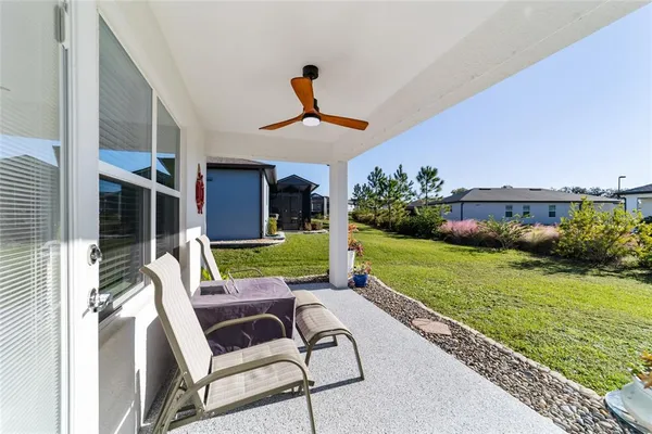 a view of house with swimming pool outdoor seating