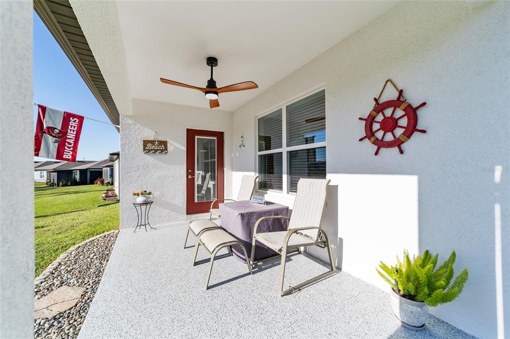 8392 Southwest 54th Street Ocala, FL 34481 - Photo 31 of 59 a dining room with furniture and a floor to ceiling window