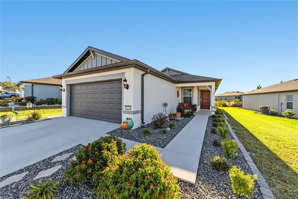 a front view of house with yard and seating area