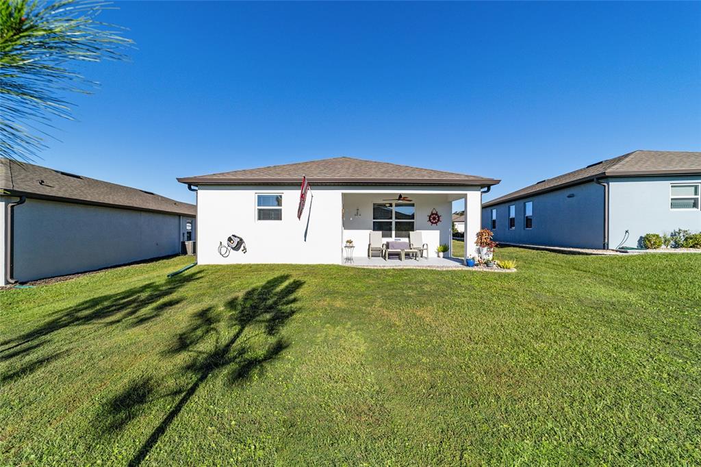 8392 Southwest 54th Street Ocala, FL 34481 - Photo 36 of 59 a front view of house with yard and seating area