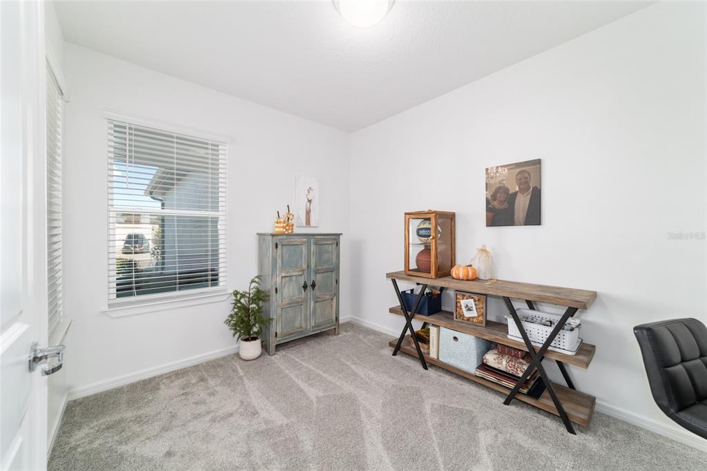 8392 Southwest 54th Street Ocala, FL 34481 - Photo 6 of 59 a view of a workspace with furniture and a window