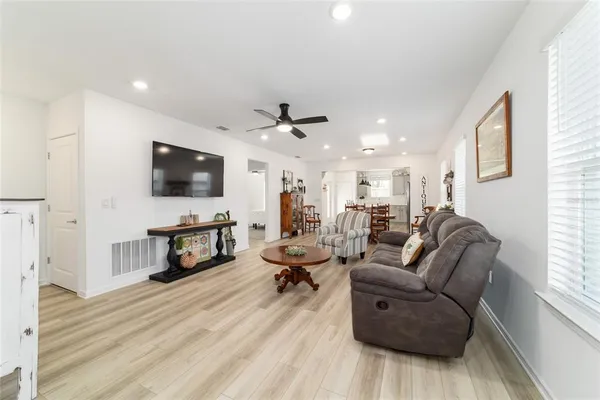 a living room with furniture and a table