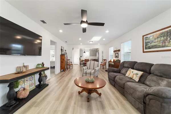 a kitchen with stainless steel appliances kitchen island granite countertop furniture and a dining table