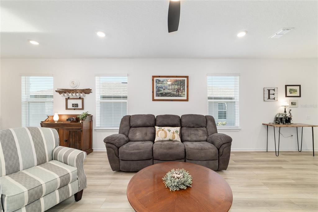 8392 Southwest 54th Street Ocala, FL 34481 - Photo 10 of 59 a living room with furniture and a table