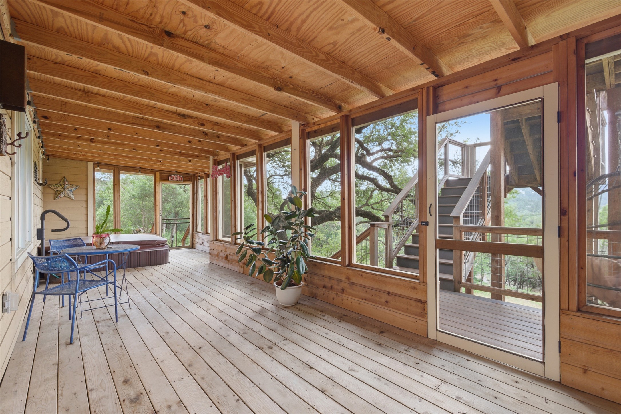 1504 Twilight Ridge Drive Austin, TX 78746 - Photo 17 of 30 Screened porch with breezes, live oak canopy views, and relaxing in the hot tub