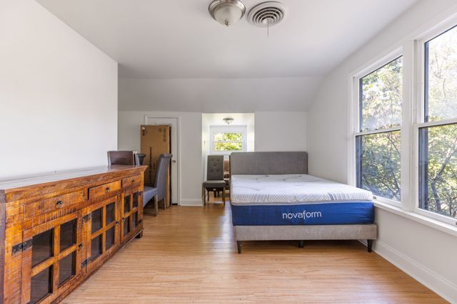 a bedroom with furniture and window