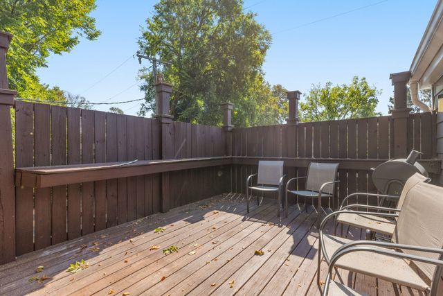 a view of balcony with wooden floor