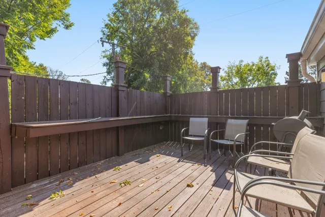 a view of balcony with wooden floor