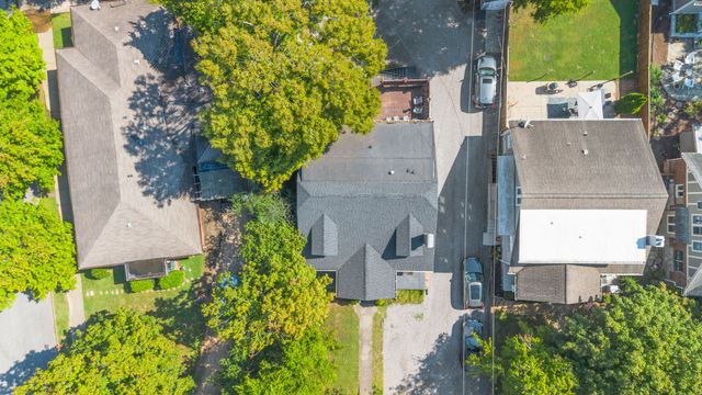 an aerial view of a house with yard swimming pool and outdoor seating