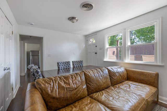 a living room with a couch and a large window