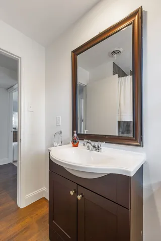 a bathroom with a sink and a mirror