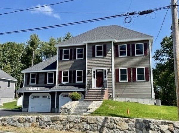 6 Shawsheen Road Billerica, MA 01821 - Photo 1 of 8 a front view of a house with a yard