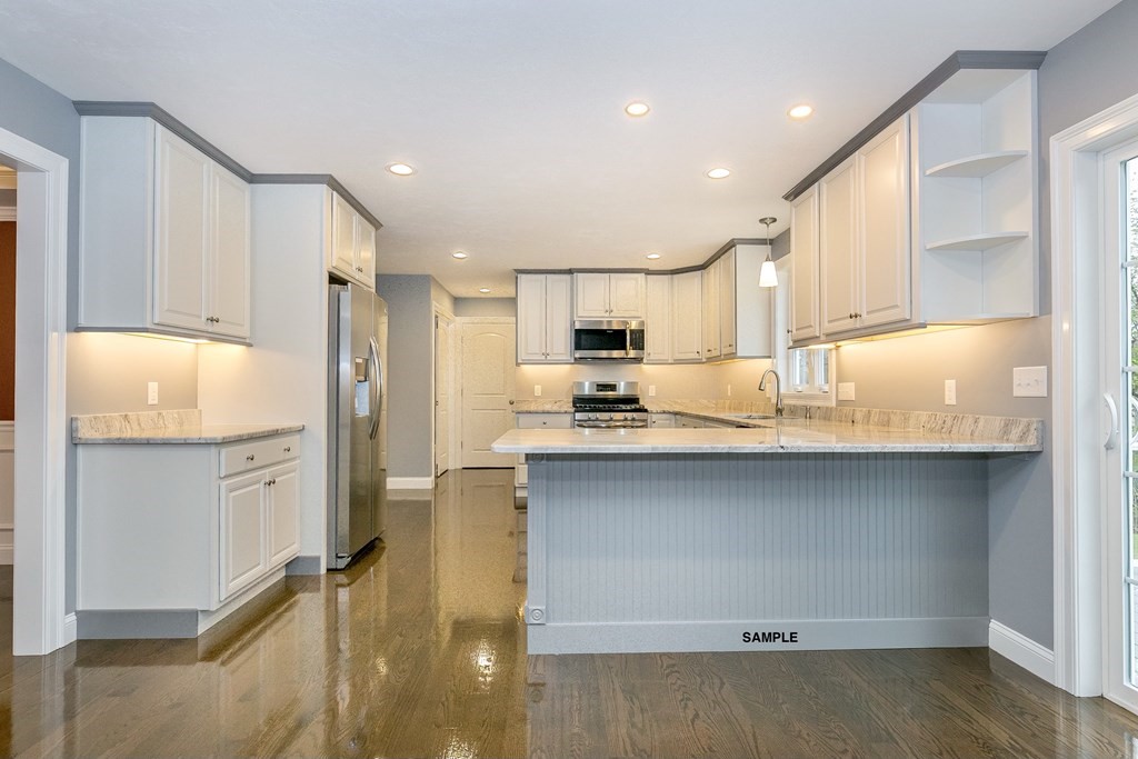 6 Shawsheen Road Billerica, MA 01821 - Photo 4 of 8 a kitchen with refrigerator cabinets and wooden floor