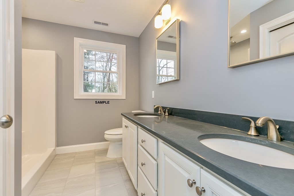 6 Shawsheen Road Billerica, MA 01821 - Photo 7 of 8 a bathroom with a granite countertop sink toilet and mirror