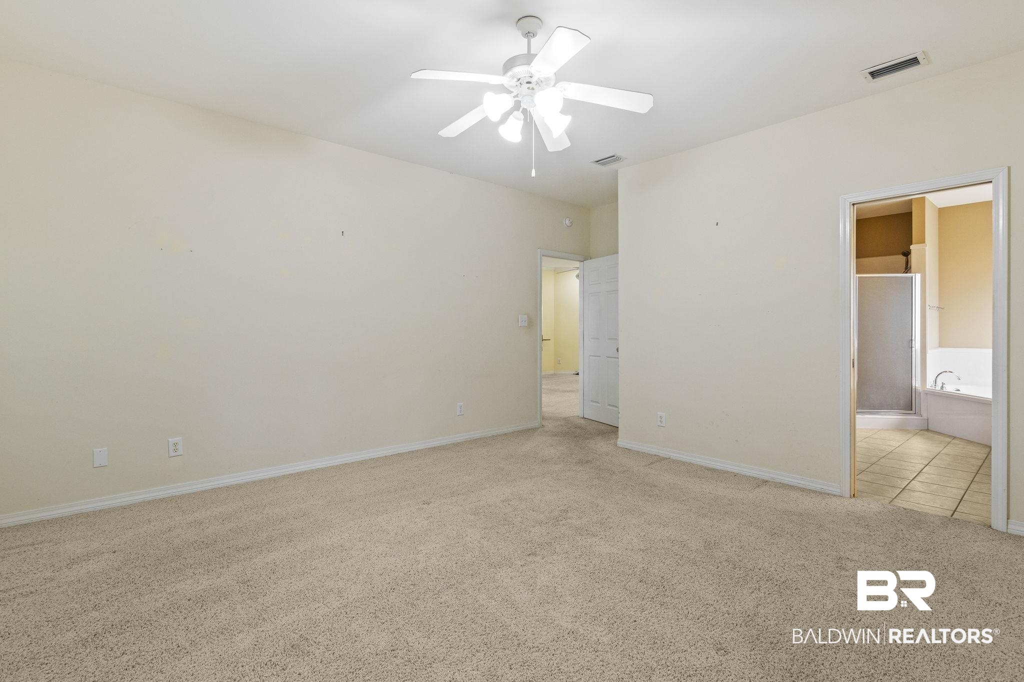 166 Club Drive Fairhope, AL 36532 - Photo 21 of 41 Unfurnished bedroom featuring ensuite bath, ceiling fan, and light colored carpet