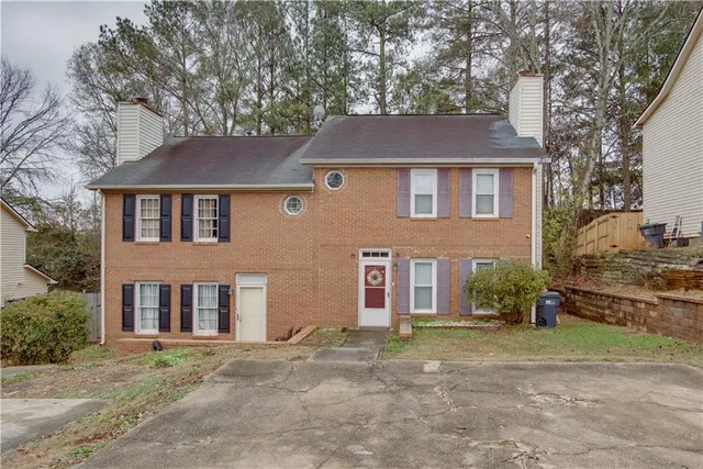 front view of a house with a yard
