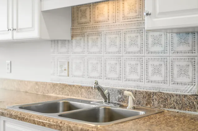 a close view of a sink and a window