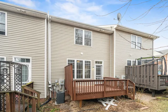 a view of a house with wooden deck