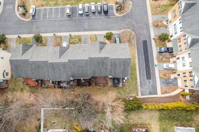 an aerial view of a house with a swimming pool