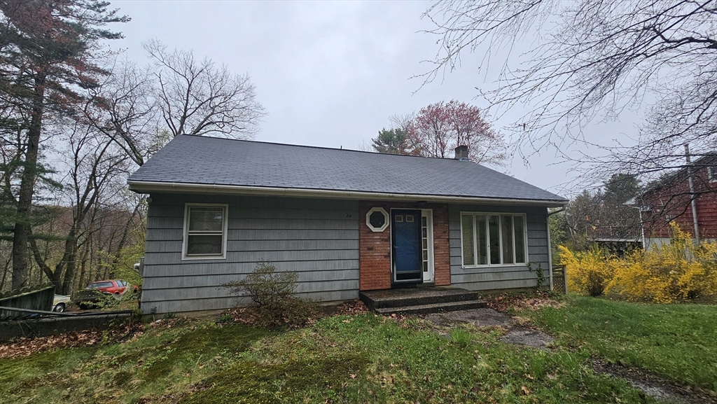 84 Stafford Holland Road Wales, MA 01081 - Photo 1 of 10 a front view of a house with garden