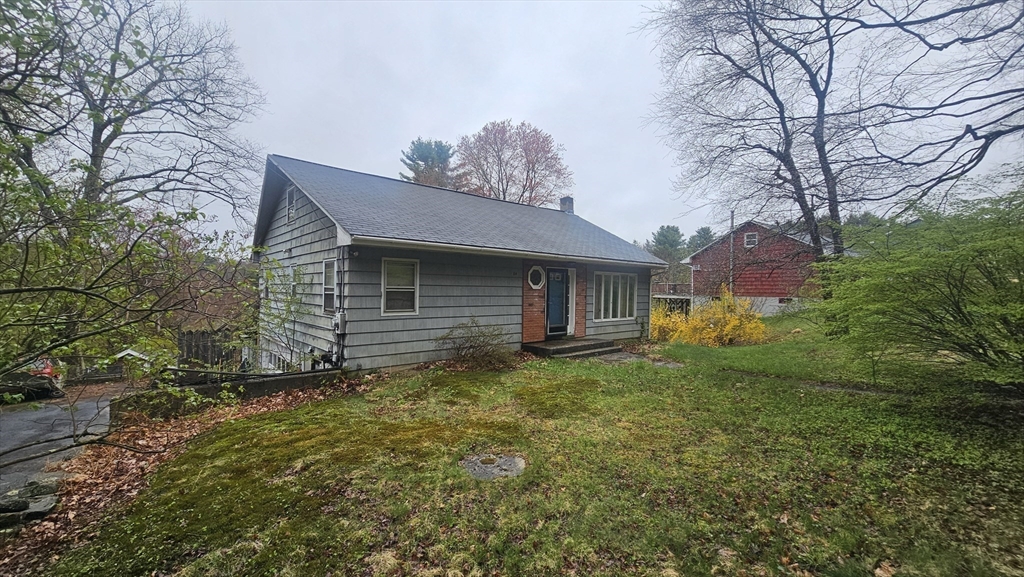 84 Stafford Holland Road Wales, MA 01081 - Photo 3 of 10 a view of a house with a yard