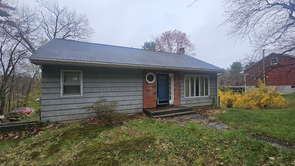 84 Stafford Holland Road Wales, MA 01081 - Photo 4 of 10 a view of a house with a yard