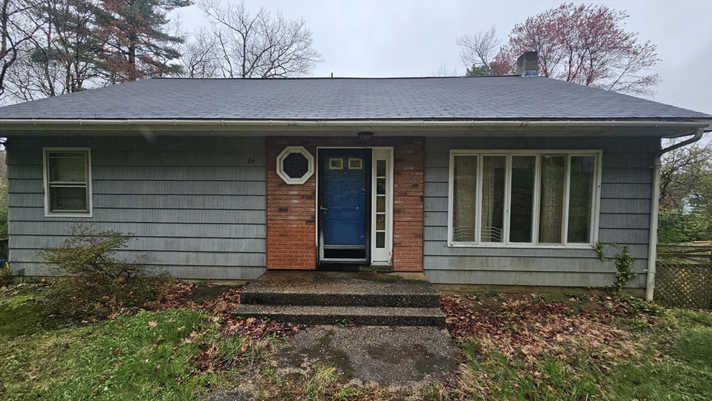 84 Stafford Holland Road Wales, MA 01081 - Photo 5 of 10 a front view of a house with garden