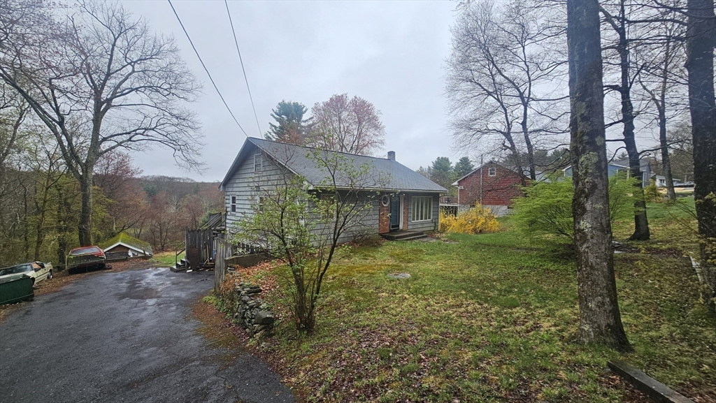 84 Stafford Holland Road Wales, MA 01081 - Photo 7 of 10 a view of a house with a yard