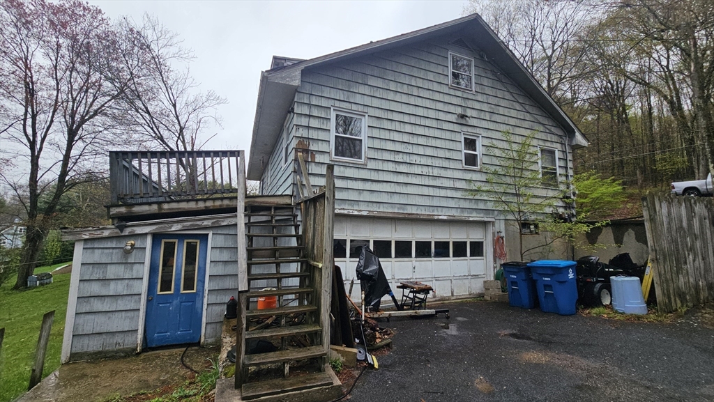 84 Stafford Holland Road Wales, MA 01081 - Photo 9 of 10 a view of house with a barbeque and large trees