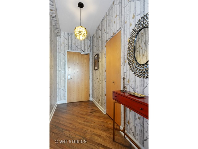41 East 8th Street, Unit 1105 Chicago, IL 60605 - Photo 3 of 15 a view of a hallway with wooden floor