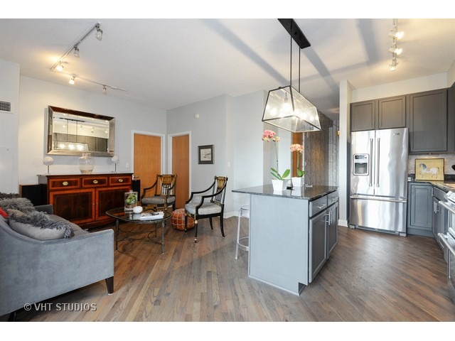 41 East 8th Street, Unit 1105 Chicago, IL 60605 - Photo 8 of 15 a living room with dining table furniture and wooden floor