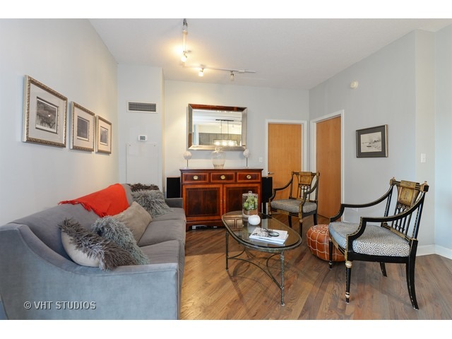 41 East 8th Street, Unit 1105 Chicago, IL 60605 - Photo 10 of 15 a living room with furniture kitchen view and a window