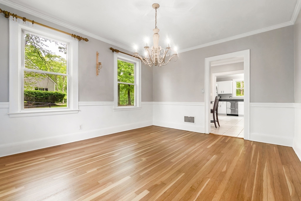 4 Valley Road Danvers, MA 01923 - Photo 11 of 42 a view of empty room with wooden floor and fan