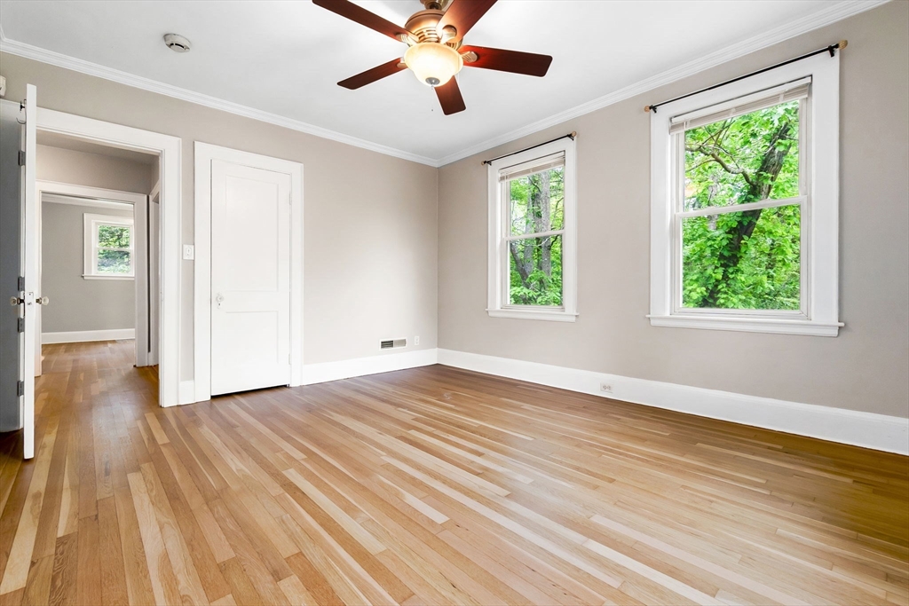 4 Valley Road Danvers, MA 01923 - Photo 17 of 42 a view of an empty room with wooden floor and a window