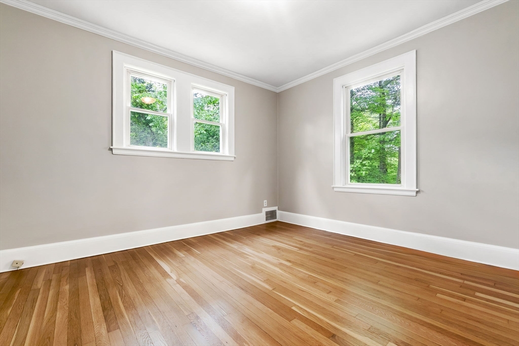 4 Valley Road Danvers, MA 01923 - Photo 18 of 42 a view of an empty room with wooden floor and a window