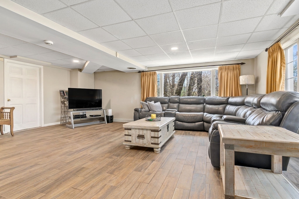 4 Valley Road Danvers, MA 01923 - Photo 27 of 42 a living room with furniture and a flat screen tv